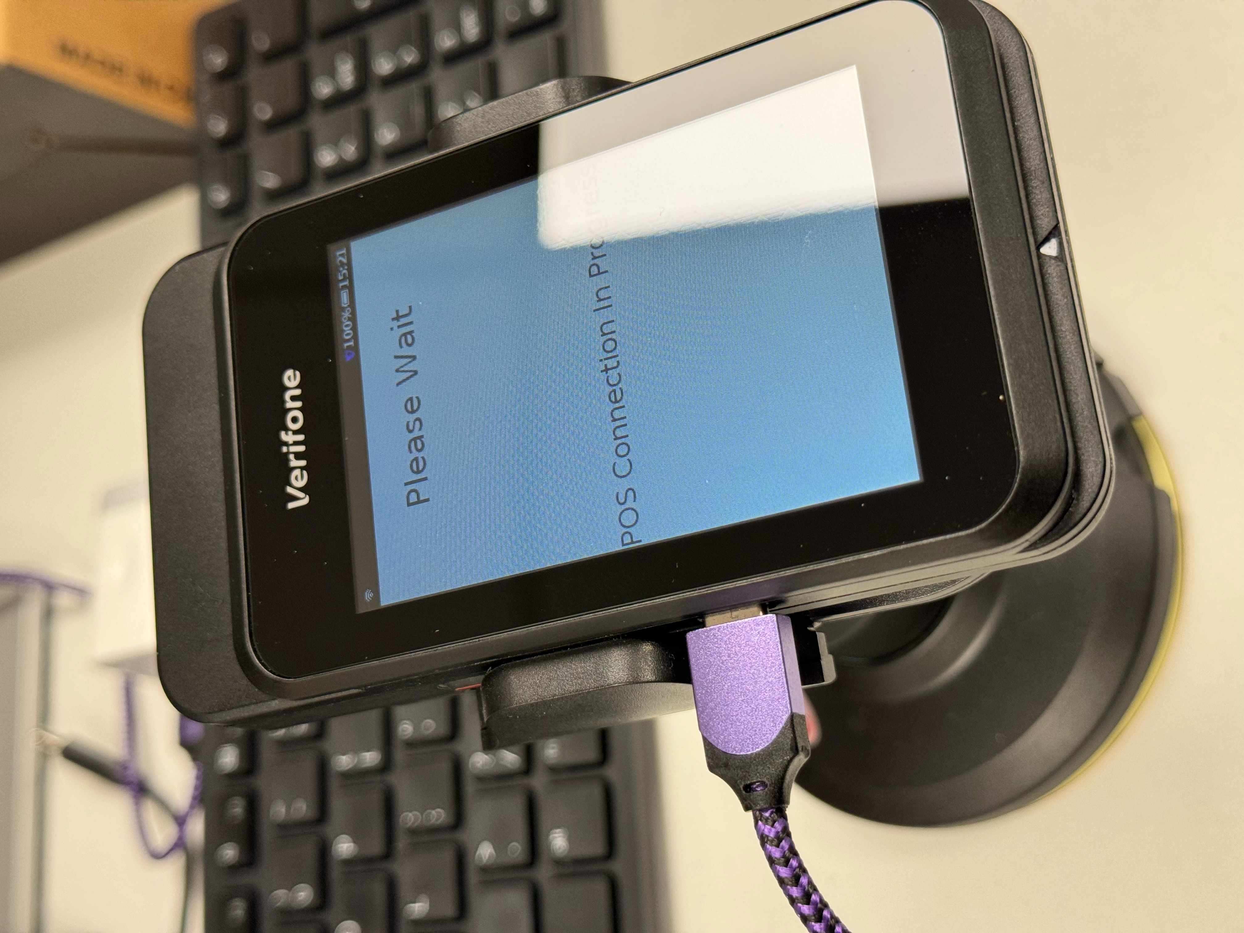 A phone on a stand

Description automatically generated